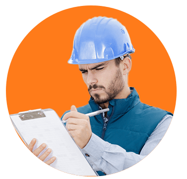 a male builder inspecting a clipboard